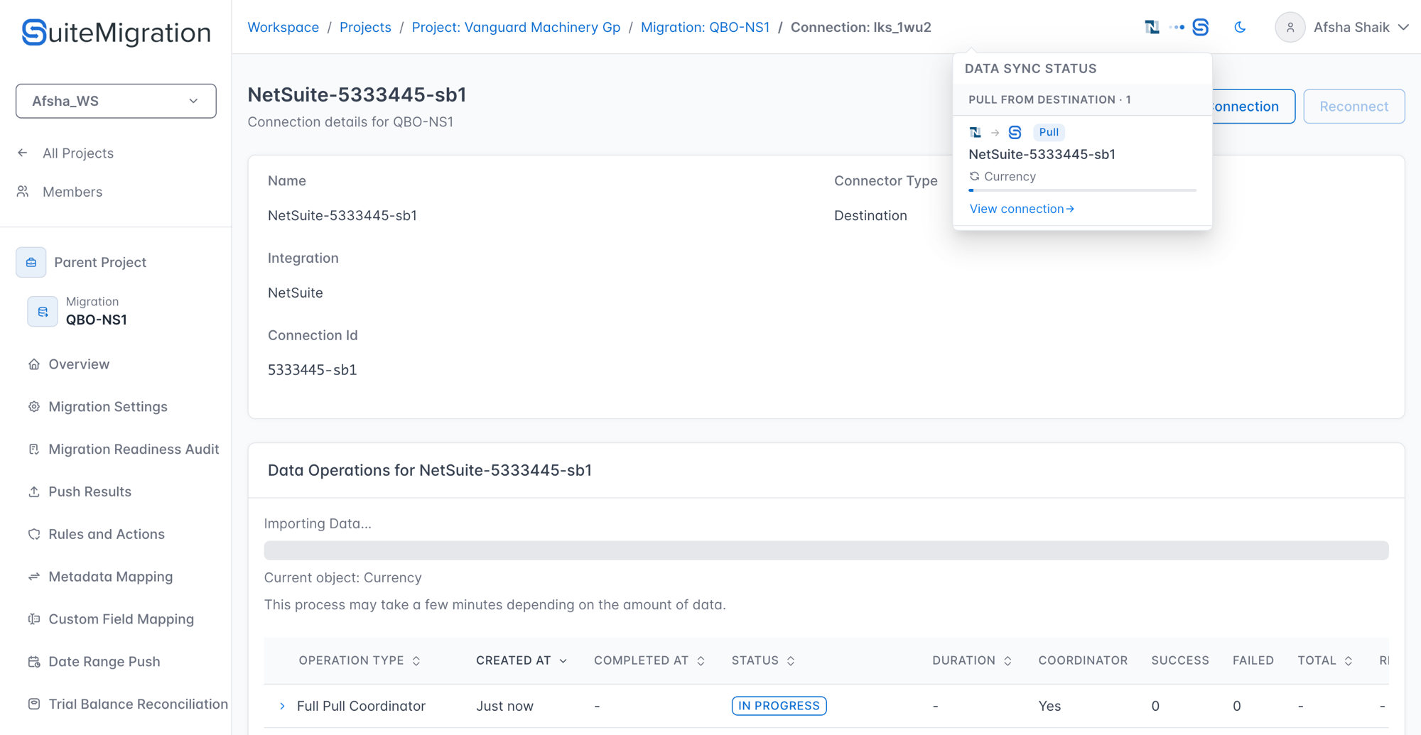 The Data Sync Status popover in the top navigation bar, showing a pull from destination in progress on the NetSuite-5333445-sb1 connection with Currency currently syncing